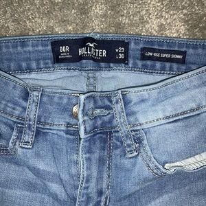 **TWO** pair of Hollister jeans.